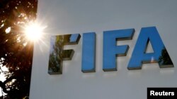 FILE - The logo of FIFA is pictured in front of its headquarters in Zurich, Switzerland.