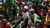 FILE - Refugees who fled Burundi's violence and political tension wait to board a U.N. ship, at Kagunga on Lake Tanganyika, Tanzania, to be taken to the port city of Kigoma, May 23, 2015.