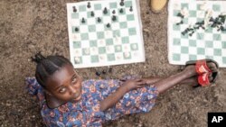 Arusi Wegeneza, 13, poses for a photo during a chess game at the Soga Chess Club of the internally displaced persons camp in Kanyaruchinya, Democratic Republic of Congo, on July 29, 2024.