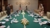 Pakistani Foreign Minister Hina Rabbani Khar (R) and Chairman of Afghanistan's High Peace Council Salahuddin Rabbani stand before their meeting at the Foreign Ministry in Islamabad, Pakistan, November 12, 2012.