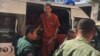 Ny Sokha, Adhoc's rights defender, was was escorted by the security officers at the appeal court, Phnom Penh, on November 28, 2016. (Kann Vicheika/VOA Khmer)
