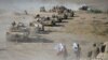 Shi'ite Popular Mobilization Forces gather with Iraqi army troops on the outskirts of Tal Afar, Iraq, Aug. 22, 2017.