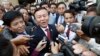Cambodia's main opposition Cambodia National Rescue Party Deputy President and National Assembly Deputy President Kem Sokha, center, speaks to reporters outside the Phnom Penh Municipality Court in Phnom Penh, Cambodia, Wednesday, April 8, 2015. 