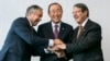 U.N. Secretary-General Ban Ki-moon (C) pose for photographers with Turkish Cypriot leader Mustafa Akinci (L) and Cypriot President Nicos Anastasiades during the Cyprus reunification talks in the Swiss mountain resort of Mont Pelerin, Switzerland, Nov. 7, 2016.