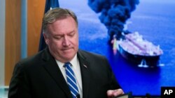 Secretary of State Mike Pompeo closes his remarks as he departs after a media availability, at the State Department, June 13, 2019.