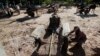 Cambodian workers use horse drawn carts for carrying sand to be used for construction through village of Samor Kroam, in Takeo province southwest of Phnom Penh, Cambodia, Tuesday, Dec. 9, 2014. (AP Photo/Heng Sinith)
