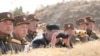 KCNA သတင်းဌာနက ထုတ်ပြန်ခဲ့သည့် မြောက်ကိုရီးယားခေါင်းဆောင် Kim Jong Un နှင့် တာဝန်ရှိသူများ လက်နက်ပစ်ခတ်မှု ကြည့်ရှုနေသည့် မြင်ကွင်း။ (မတ် ၂၀၊ ၂၀၂၀)