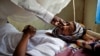 FILE - A patient with hepatitis is treated at a hospital in El Sereif village, North Darfur, Sudan, May 13, 2013.