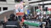 Protesters wave Palestinian flags during a protest to demand reproductive rights, defend the rights of LGBTQ people and demand a ceasefire in Gaza on the eve of the Democratic National Convention at the United Center in Chicago, Illinois, on Aug. 18, 2024.