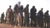 Quatre autres hommes sont visés: Alghabass Ag Intalla, Bilal Ag Acherif, Fahad Ag Almahmoud et Achafagui Ag Bouhada, des chefs de la rébellion touareg qui a repris les armes contre l'Etat malien en 2023. (Photo: Rebelles touareg dans le Nord-Mali (fév. 2012)