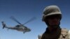 A medevac helicopter lifts off from Camp Nathan Smith in Kandahar city, carrying an unidentified NATO soldier on 9 June 2010