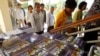 Cambodian villagers walk to enter a courtroom before the first appeal hearings against two former Khmer Rouge senior leaders, Khieu Samphan and Nuon Chea, at the U.N.-backed war crimes tribunal in Phnom Penh, Cambodia, Thursday, July 2, 2015. The two former Khmer Rouge leaders are facing charges of genocide, war crimes and crimes against humanity. (AP Photo/Heng Sinith)