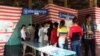 Voters wait in line to vote in the 2013 commune election, Phnom Penh, Cambodia. 