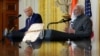 U.S. President Donald Trump and Indian Prime Minister Narendra Modi are pictured in a mirror as they attend a joint press conference at the White House in Washington, Feb. 13, 2025.