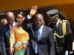 FILE - Congolese President Joseph Kabila, center, waves as he and others celebrate independence for the Democratic Republic of Congo in Kindu, Congo, June 30, 2016.