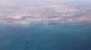 FILE - An aerial view shows the coastline of the Caspian Sea near Baku, Azerbaijan, May 27, 2019. More than half of the world's large lakes and reservoirs have shrunk since the early 1990s, chiefly because of climate change, an international research team says.