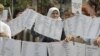 FILE - Bosnian Muslim women from Visegrad hold a peaceful protest of the U.N. war crimes tribunal's failure to include counts of rape in indictments against Bosnian Serb cousins Milan and Sredoje Lukic, Sarajevo, July 18, 2008.
