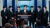 FILE - RM, center, and other K-pop supergroup BTS members at daily briefing at the White House in Washington, May 31, 2022.