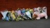 Flowers and a stuffed animal are seen behind the police cordon near the scene of a stabbing incident in Southport, Britain, July 29, 2024.