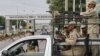 Paramilitary soldiers guard main entrance of air force base in Kamra, Punjab province, August 16, 2012. 