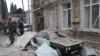 Emergencies personnel work in a damaged area of the city of Ganja following a reportedly Armenian rocket strike on October 4, 2020