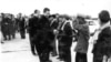 In this undated photo provided by Documentation Center of Cambodia, the late Khmer Rouge leader Pol Pot, center, greets Khmer Rouge cadre in Phnom Penh airport, Cambodia. 