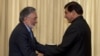 Afghan Foreign Minister Zalmay Rasoul, left, shakes hands with Pakistan's Prime Minister Raja Pervaiz Ashraf in Islamabad, Pakistan, November 30, 2012.
