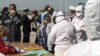 Rescued migrants arrive at the southern Italian port of Corigliano, Italy, April 15, 2015.