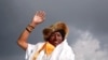FILE - Kami Rita Sherpa, a Nepali mountaineer, waves toward the media in Kathmandu, Nepal, May 20, 2018.