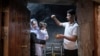 A child is baptized in Lalish, the Yazidi's most holy temple, in the Shekhan district of the Kurdistan region of Iraq, June 24, 2024.