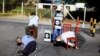 FILE - Mannequins depicting torture victims are left by demonstrators protesting against former Salvadoran army General Jose Guillermo Garcia prior to Garcia's arrival, at El Salvador International Airport in San Luis Talpa, Jan. 8, 2016. 