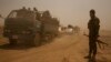 FILE - Hundreds of civilians, riding on trucks and in cars, flee villages outside Islamic State-held Mosul, Aug. 15, 2016. With fighting now underway to liberate the city, up to a million civilians are expected to flee the region.