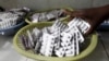FILE - A pharmacist dispenses antiretroviral drugs at Mater Hospital in Kenya's capital Nairobi, Sept. 10, 2015. 