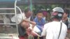 တိုက်ပွဲဖြစ်ပွါးရာ ချိန်ခါလီကျေးရွာမှ ပိတ်မိသူ သက်ကြီးရွယ်အိုများကို ကယ်ထုတ်စဉ်။ (ဓါတ်ပုံ -MP Oung Thaung Shwe)