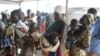 FILE - Women who fled fighting in South Sudan arrive at Bidi Bidi refugee’s resettlement camp in northern Uganda, Dec. 7, 2016.