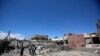 FILE - Yemeni people inspect the damage after an airstrike by Saudi-led coalition in Sana'a, Yemen, Saturday, Feb. 27, 2016. 