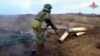 Фото з відео, розповсюдженого міністерством оборони Росії 12 листопада 2022 р. (Russian Defense Ministry Press Service via AP)