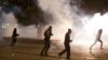 Israel's mainly Jewish Ethiopians clash with Israeli riot police during a protest against racism and police brutality in Tel Aviv, Israel, Sunday, May 3, 2015.