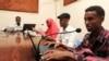 Qaran radio reporters broadcast morning news from their studio in Mogadishu, June 28, 2013. A report documents widespread violations in Somalia against journalists, human rights defenders and political leaders, including numerous killings, arbitrary arrests and detention, intimidation and closure of critical media outlets.
