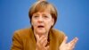 Yeniden parti genel başkanı seçilen Almanya Başbakanı Angela Merkel kongrede konuşurken
