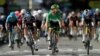 FILE - Cyclists are seen during stage 13 of the Tour de France, from Nimes to Carcassonne, France, July 9, 2021.