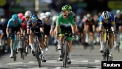 FILE - Cyclists are seen during stage 13 of the Tour de France, from Nimes to Carcassonne, France, July 9, 2021.