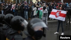Belarusian opposition supporters hold a rally in Minsk