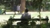 FILE - A man sits on a bench in a park in Harare, Zimbabwe, March 26, 2014. Zimbabwe has taken a new approach to addressing mental health issues by installing 'friendship benches' for counseling sessions.