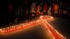 FILE - Nepalese women and children light candles on the eve of World AIDS Day in Kathmandu, Nepal, Nov. 30, 2015. 