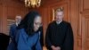 Hakim Ketanji Brown Jackson menandatangani sumpahnya sebagai Hakim Mahkamah Agung, disaksikan Hakim Mahkamah Agung John Roberts dalam acara pelantikan di Washington, pada 30 Juni 2022. (Foto: Collection of the Supreme Court of the United States/Handout via Reuters)