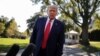U.S. President Donald Trump talks to reporters as he departs for campaign travel to Ohio from the South Lawn at the White House in Washington, Sept. 21, 2020. 