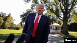 U.S. President Donald Trump talks to reporters as he departs for campaign travel to Ohio from the South Lawn at the White House in Washington, Sept. 21, 2020. 