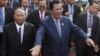 Cambodia's Prime Minister and President of the People's Party, Hun Sen, center, arrives at an event marking the 38th anniversary of the 1979 downfall of the Khmer Rouge regime in Phnom Penh, Cambodia, Saturday, Jan. 7, 2017. (AP Photo/Heng Sinith)