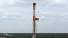 Буровая установка на сланцевом нефтегазовом месторождении на западе Техаса.